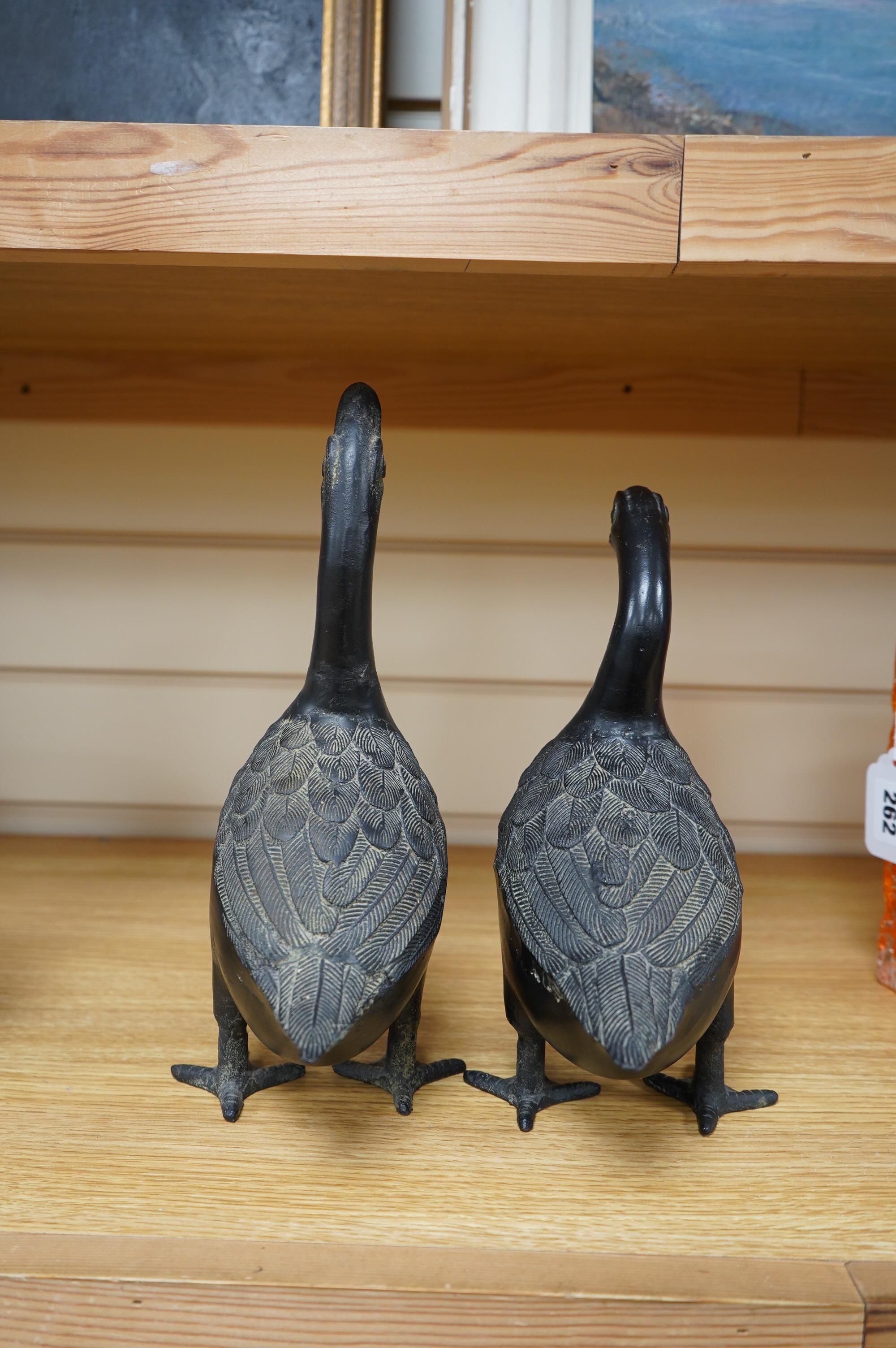 Two 20th century Japanese cast iron models of ducks, 28.5cm. Condition - fair to good